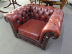 A buttoned Chesterfield oxblood leather club armchair (a/f)