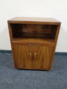 An early twentieth century bedside cabinet together with a dressing table stool and a foot stool.