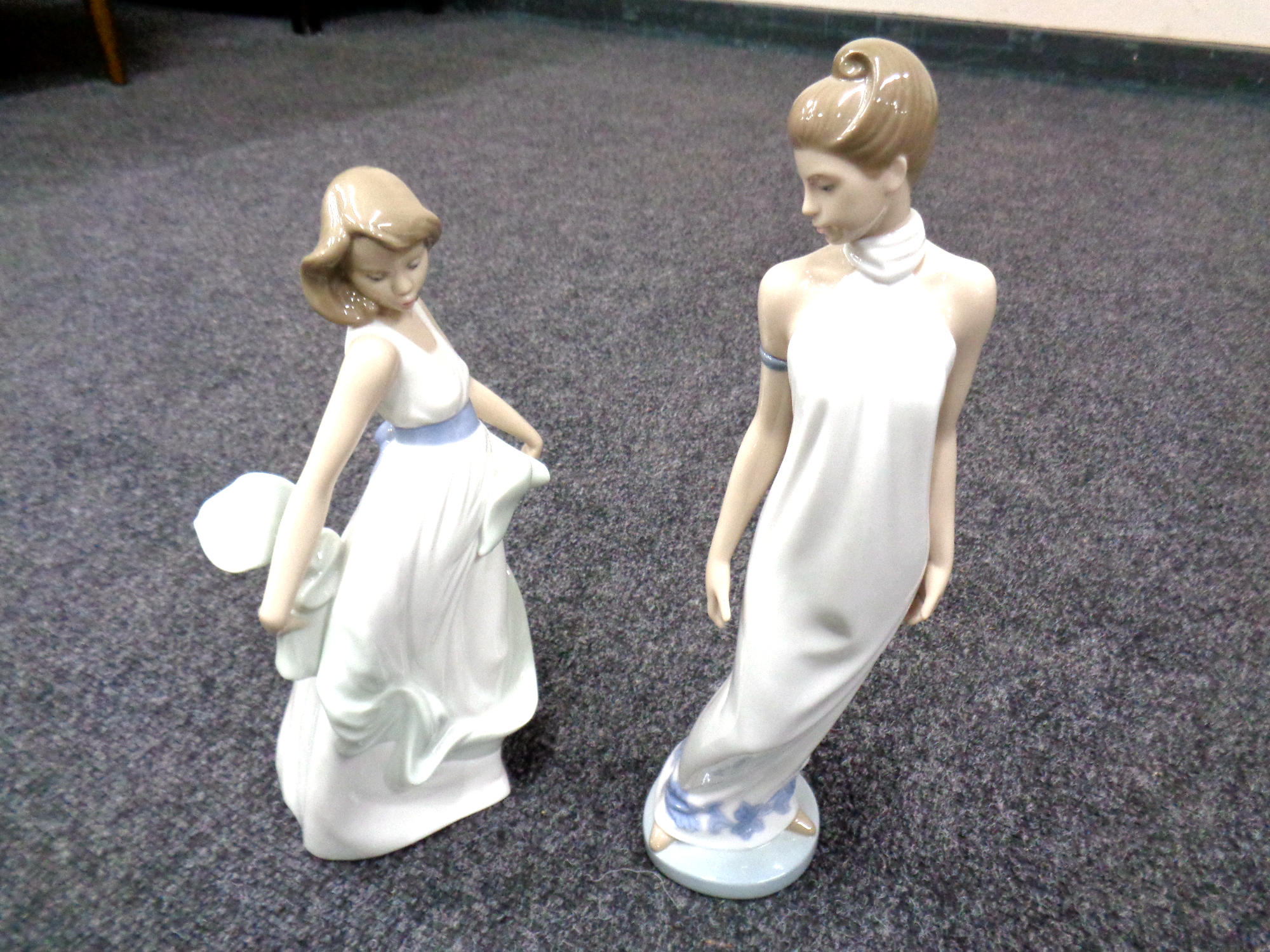 Two Nao figures of ladies.