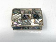 A mother of pearl and white metal snuff box