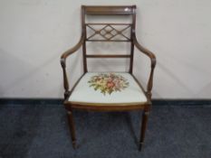 An early 20th century mahogany armchair with tapestry seat.