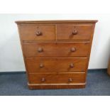 A Victorian satinwood five drawer chest