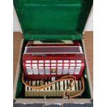 A Parrot piano accordion in case