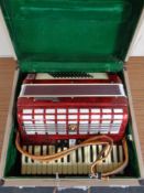 A Parrot piano accordion in case