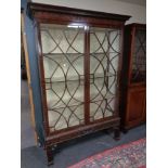 A late Victorian Chippendale style astral glazed mahogany bookcase on stand