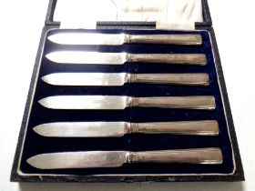 A cased set of six silver handled butter knives by Elkington & Co