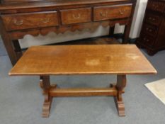 An oak refectory coffee table