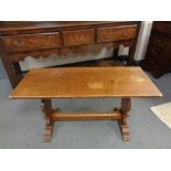 An oak refectory coffee table