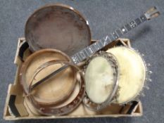 A box of banjo bodies and skins (for restoration)