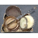 A box of banjo bodies and skins (for restoration)