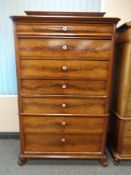 A 19th century continental mahogany seven drawer chest