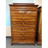 A 19th century continental mahogany seven drawer chest