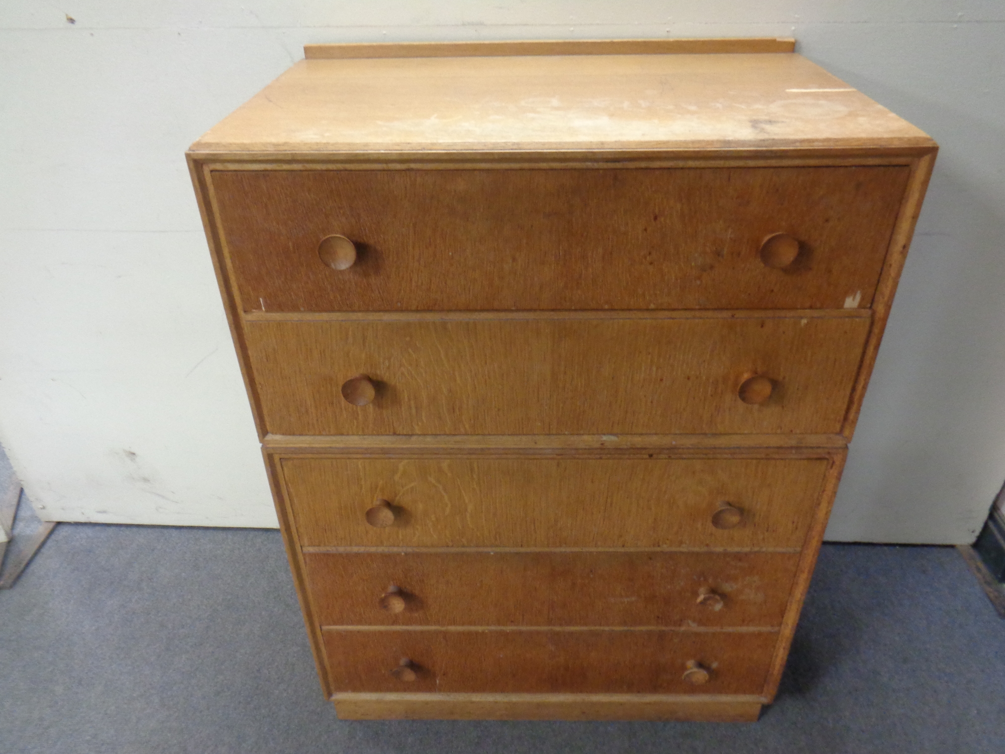 A 20th century oak five drawer chest