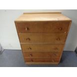 A 20th century oak five drawer chest