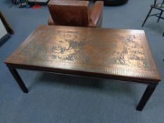 A continental copper topped rectangular coffee table