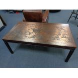 A continental copper topped rectangular coffee table
