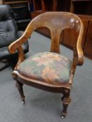 A 19th century continental walnut elbow chair