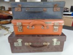 Three small vintage suitcases