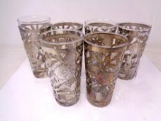 A set of six pierced silver glass holders and glasses, stamped 925,