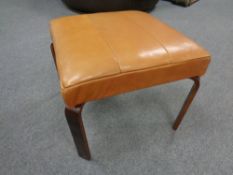 A 20th century tan leather upholstered footstool