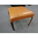 A 20th century tan leather upholstered footstool