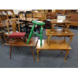 A group of occasional furniture comprising two stools,
