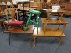 A group of occasional furniture comprising two stools,