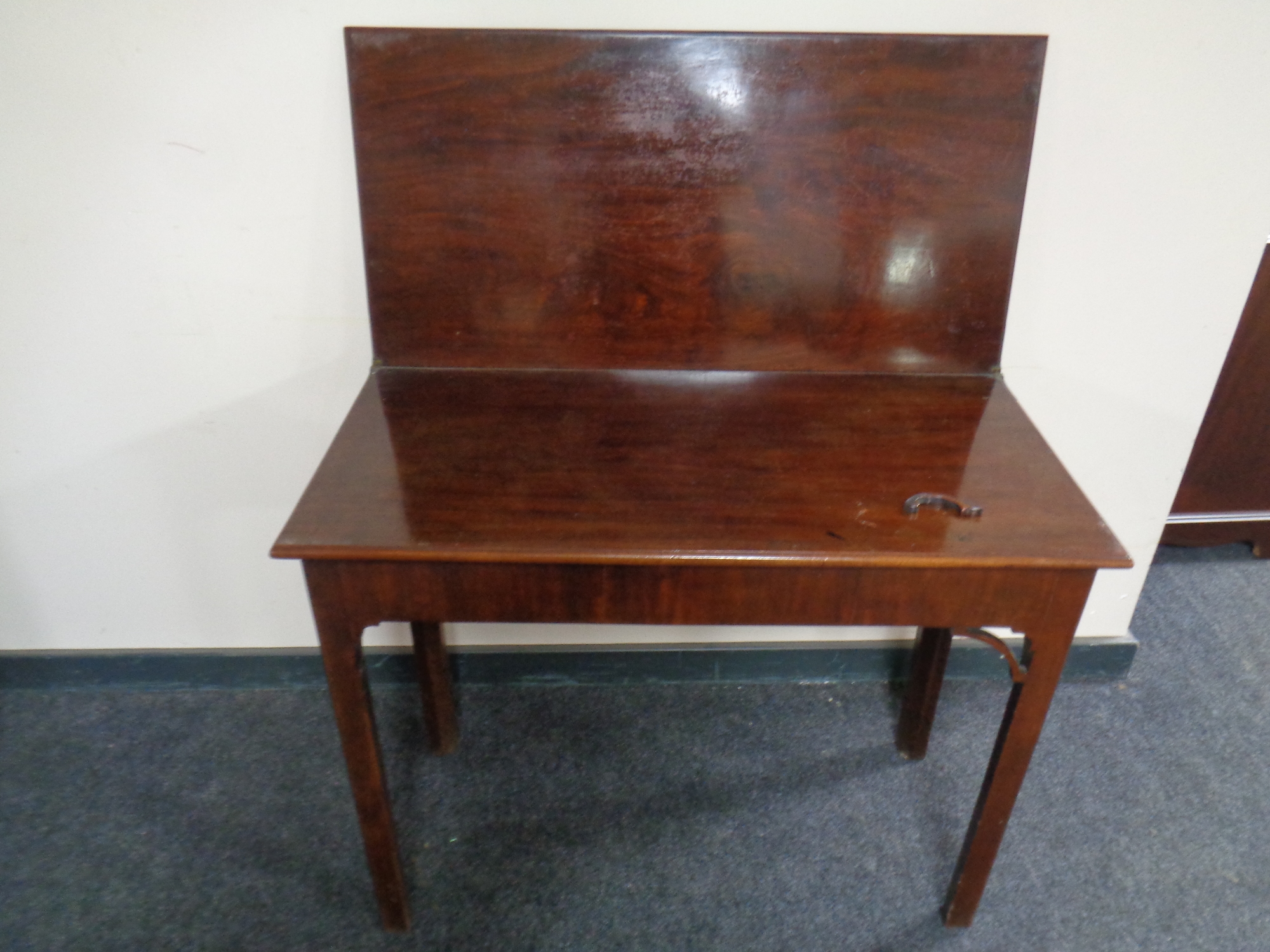 A 19th century mahogany turnover top tea table