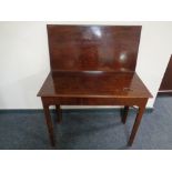 A 19th century mahogany turnover top tea table