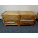 A pair of oak effect two drawer bedside chests