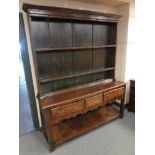 A George III and later oak kitchen dresser
