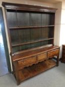 A George III and later oak kitchen dresser