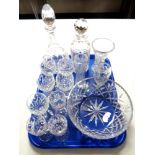 A tray containing a quantity of good quality cut glass lead crystal including decanters,