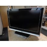 A JVC 32 inch LCD TV with remote