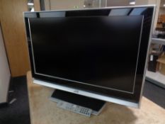 A JVC 32 inch LCD TV with remote