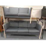 A late 20th century continental three seater settee in grey upholstery with matching two seater