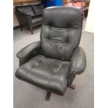 A continental black leather upholstered armchair on stained beech support