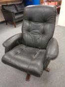 A continental black leather upholstered armchair on stained beech support