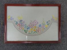 An embroidered twin-handled serving tray