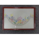 An embroidered twin-handled serving tray