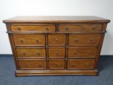A Colonial style eleven drawer chest