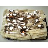 A tray of EPNS table forks and spoons