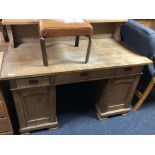 A 19th century continental oak twin pedestal desk