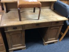 A 19th century continental oak twin pedestal desk