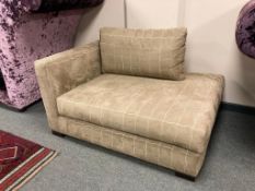 A small upholstered corner chair, width 136 cm.