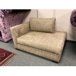 A small upholstered corner chair, width 136 cm.