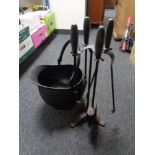 A four piece companion set on stand with a swing handled coal bucket (black)