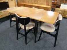 A mid-20th century oak and ebonised dining room sweet comprising of low sideboard,