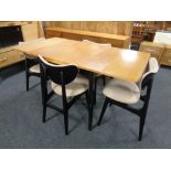 A mid-20th century oak and ebonised dining room sweet comprising of low sideboard,