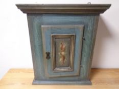 A continental painted pine single door wall cabinet
